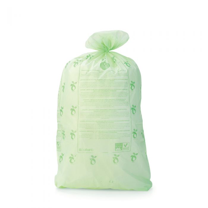 Tied PerfectFit 10L compostable bin liner, Code K, in pale green