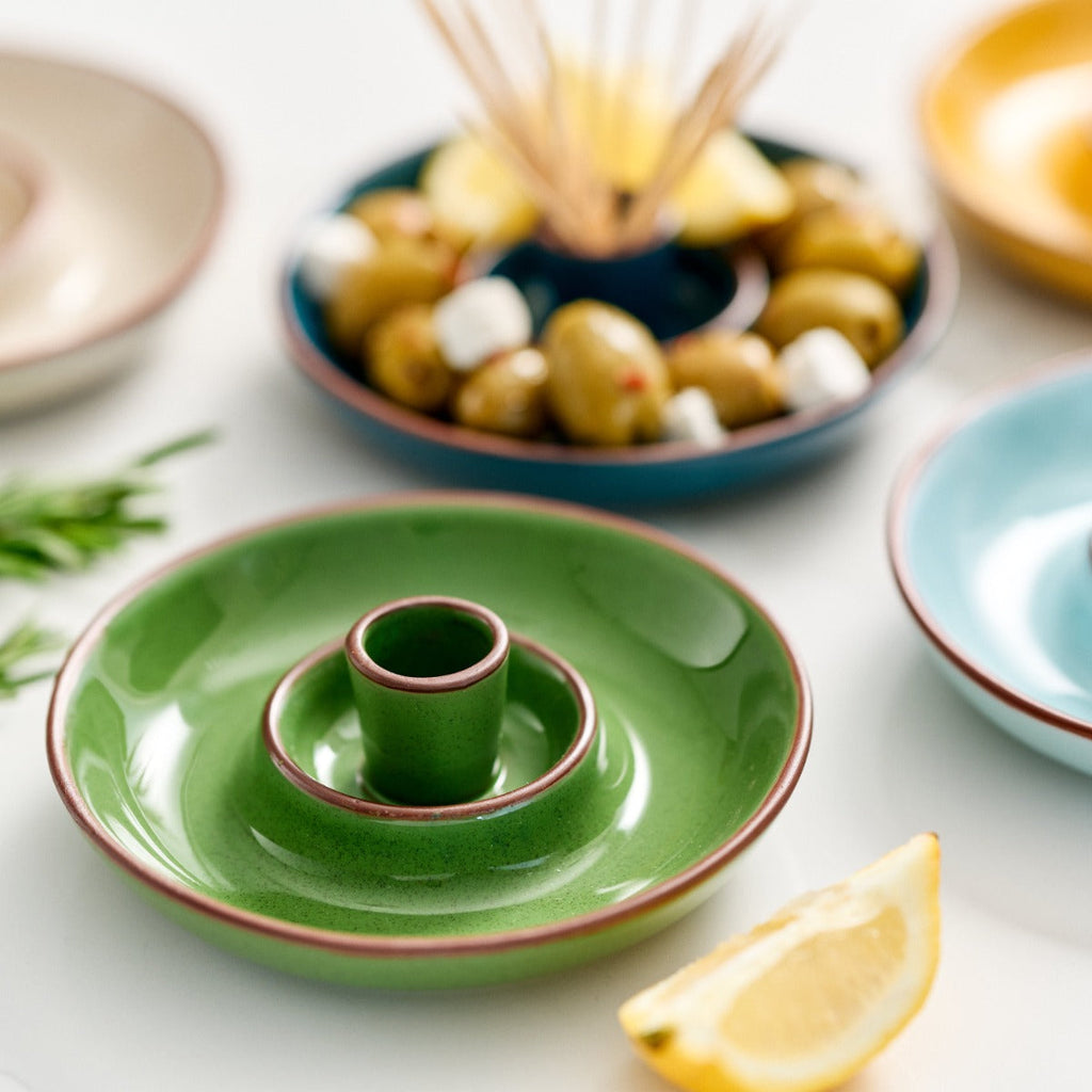  finished in green glaze with an integrated pip well and stick holder