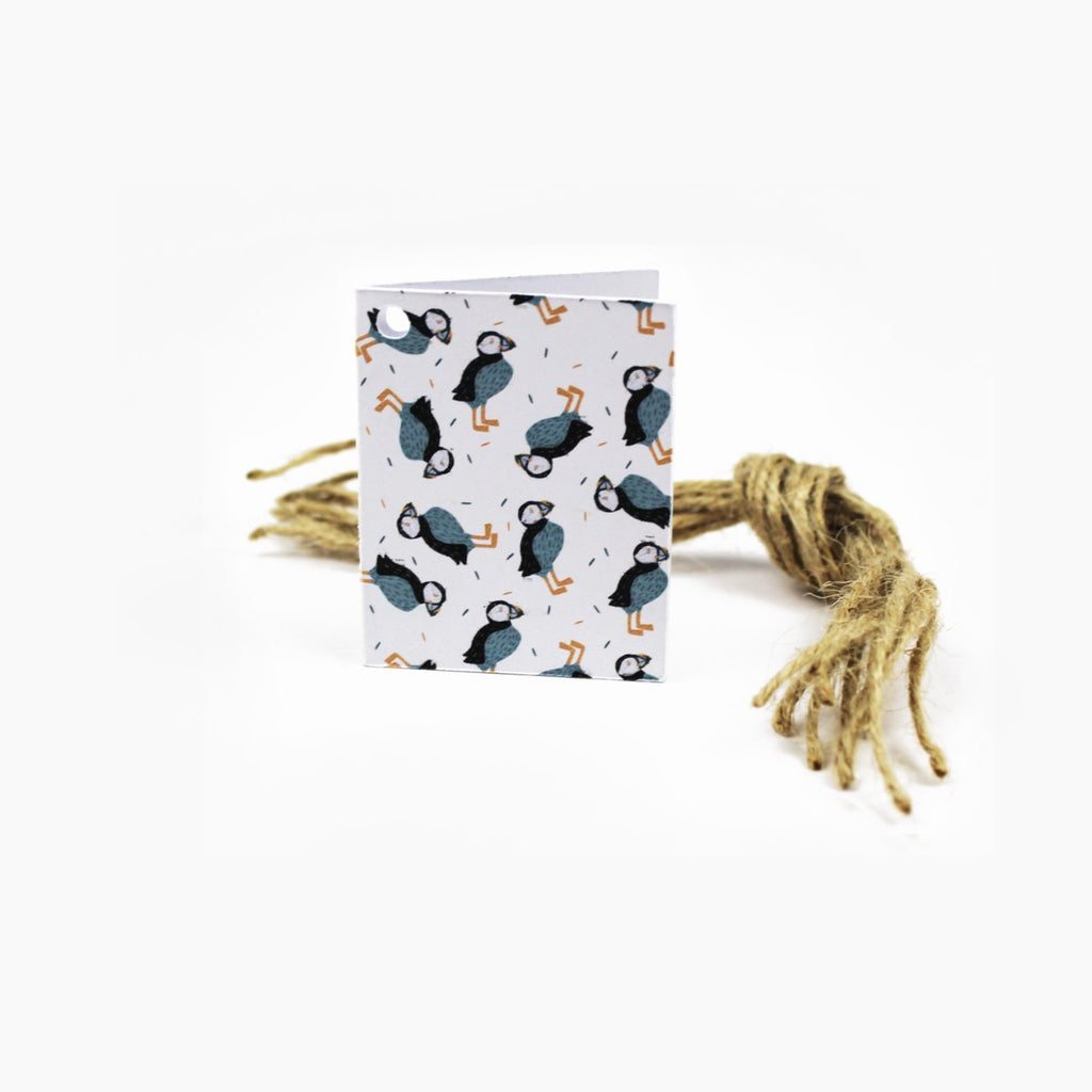  featuring a puffins print. Tags presented with pre-cut twine lengths.