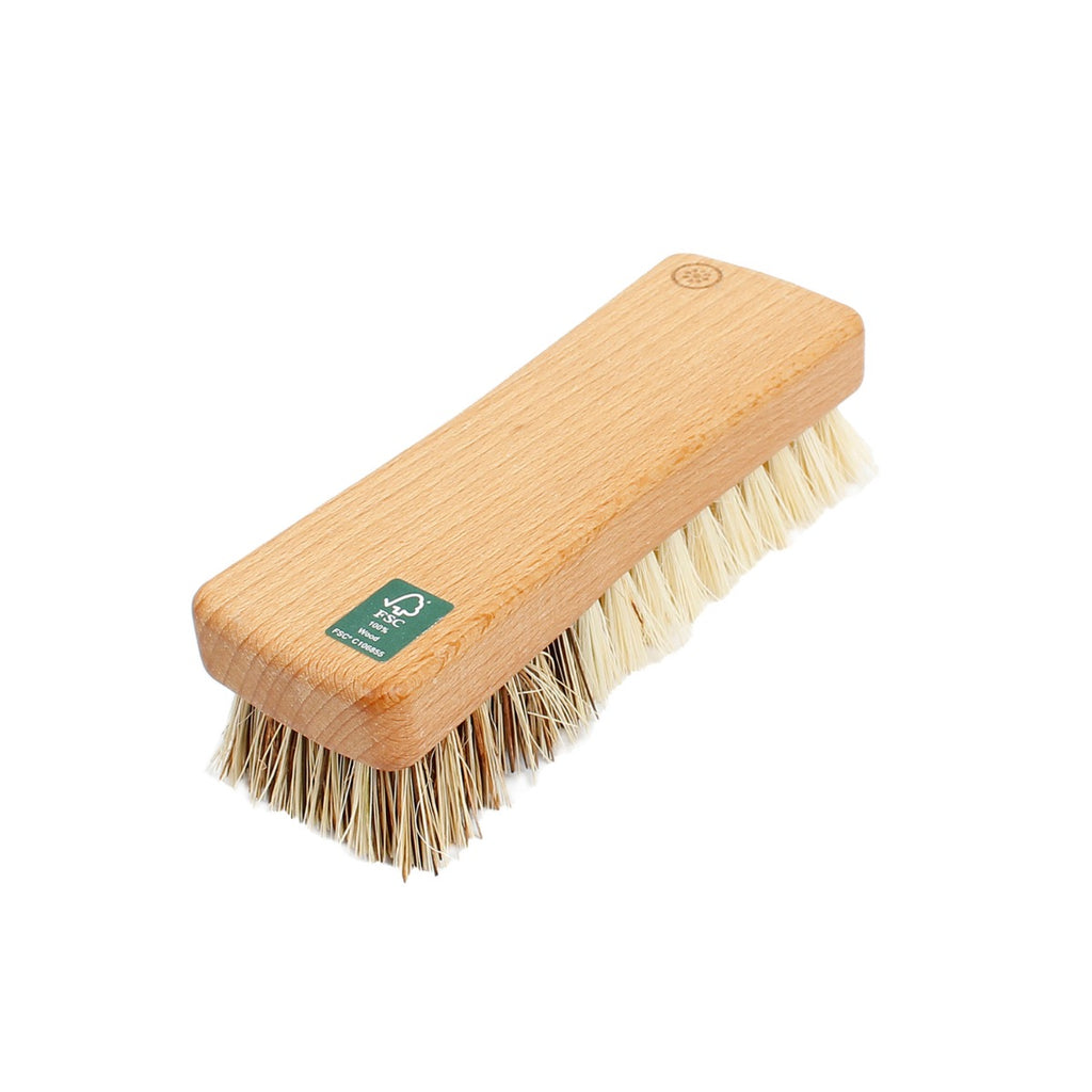 Wooden vegetable brush with two bristle types, one side soft and one firm, shown on a white background
