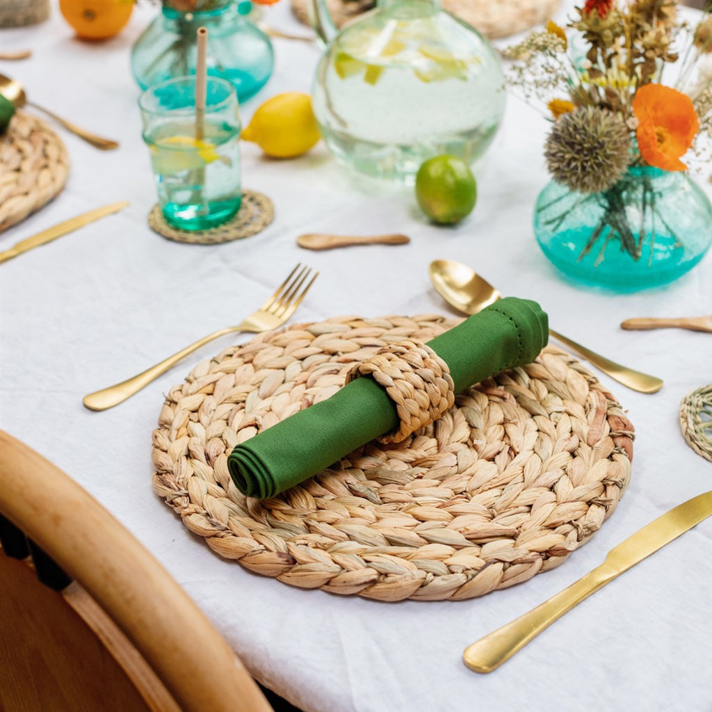  featuring water hyacinth napkin rings holding green napkins