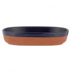 Oval shaped terracotta cookware and serveware dish with a navy blue dip glazed finish.