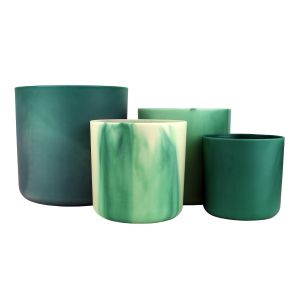 set of four green plastic plant pots made from recycled ocean waste