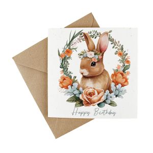 Happy birthday wildflower seed plantable greetings card featuring a cute bunny surrounded by floral wreath. Presented with a kraft envelope.