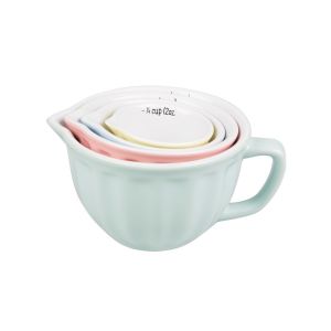 a set of four ceramic measuring cups, in pastel colours